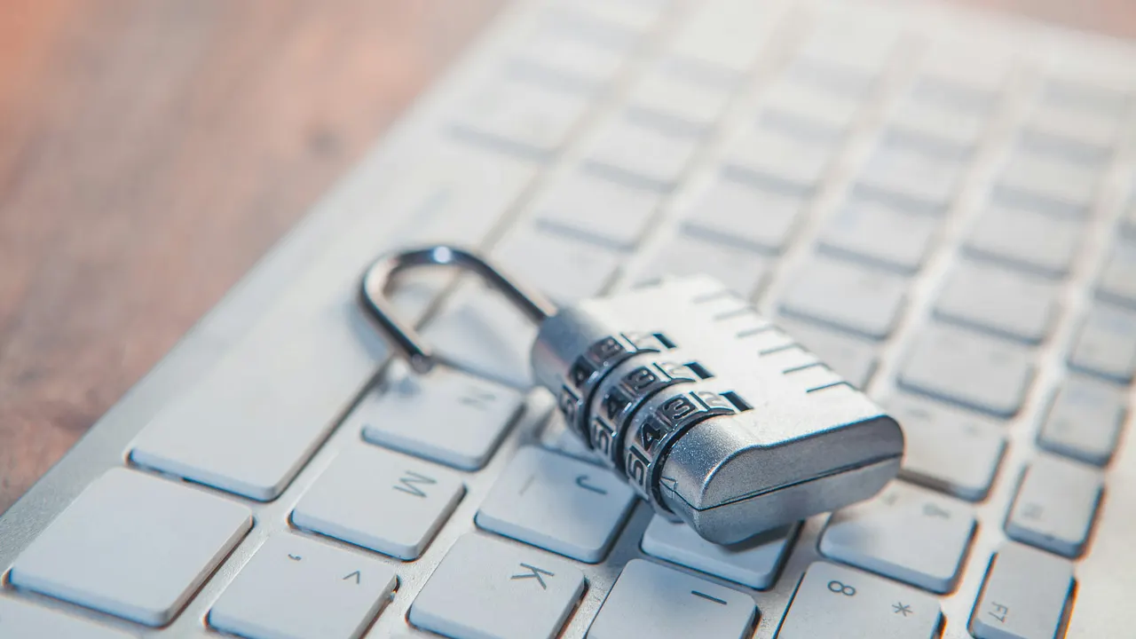 Locked padlock on a laptop keyboard representing strong access security